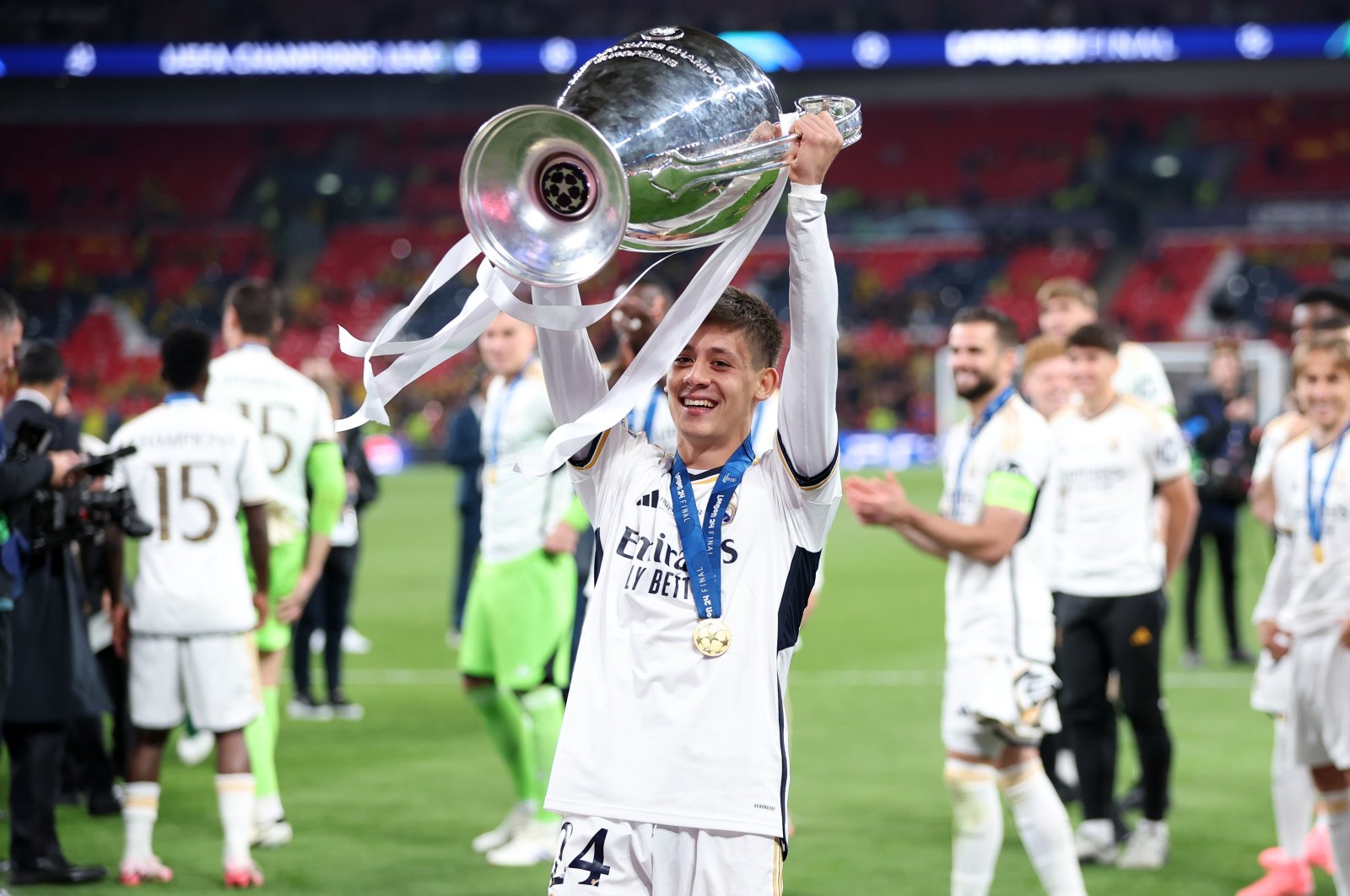 Real Madrid&#039;s Arda Güler celebrates with the trophy after winning the UEFA Champions League final match against Borussia Dortmund, London, U.K., June 1, 2024. (EPA Photo)