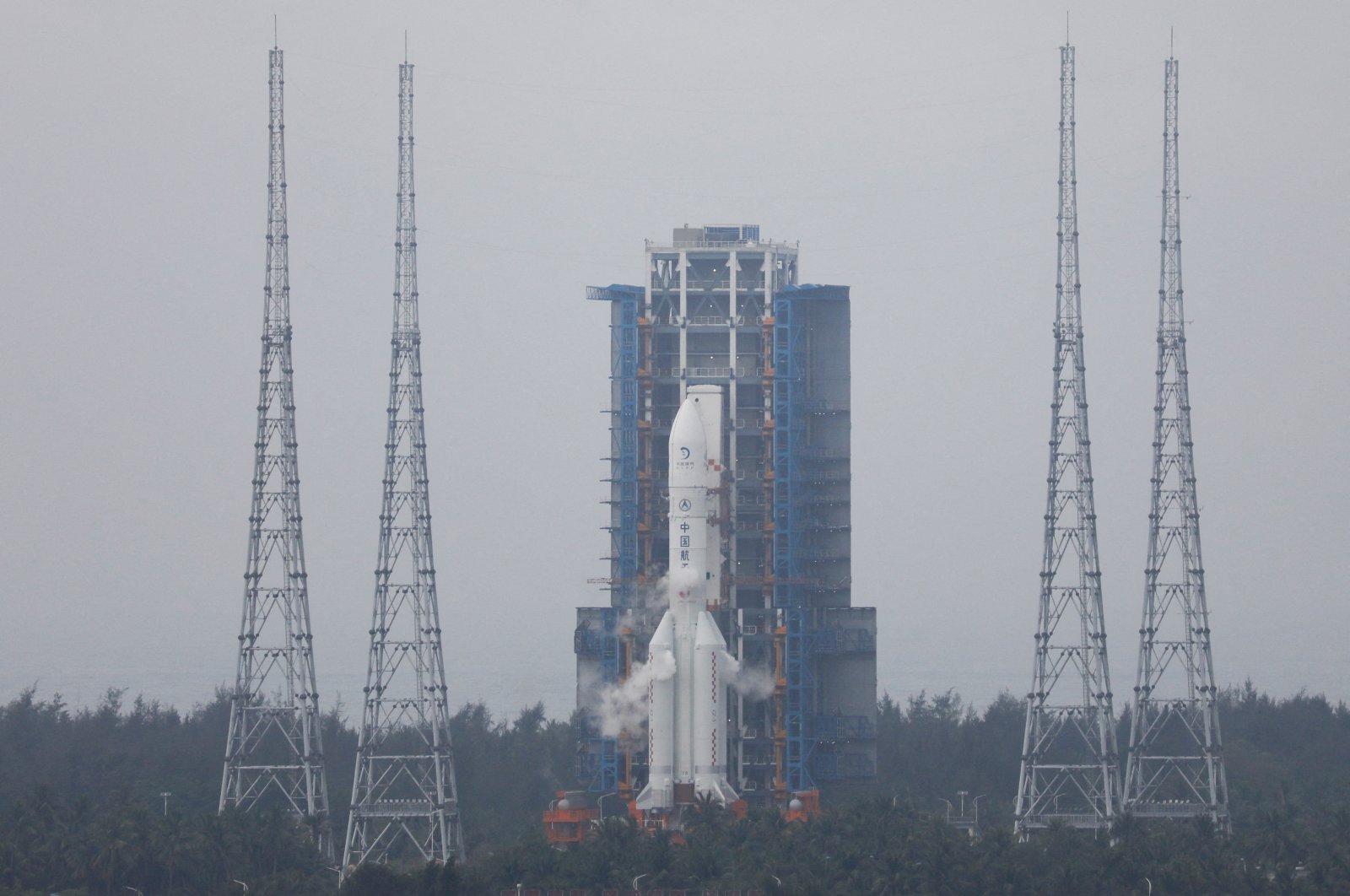 The Chang&#039;e 6 lunar probe and the Long March-5 Y8 carrier rocket combination sit atop the launch pad at the Wenchang Space Launch Site in Hainan province, China, May 3, 2024. (Reuters Photo)