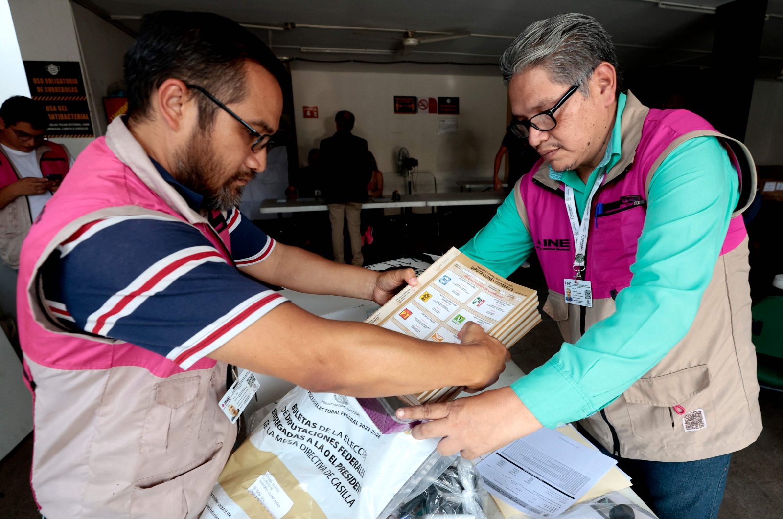 Officials from the National Electoral Institute (INE) prepare a package with electoral material in Guadalajara, Jalisco state, Mexico, on May 31, 2024. (AFP Photo)