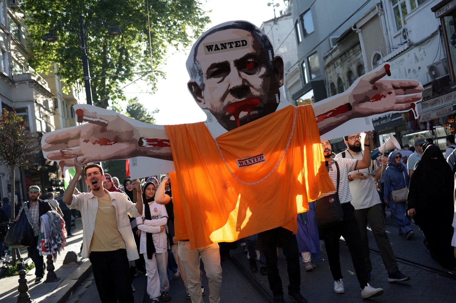 Demonstrators carry a placard depicting Israeli Prime Minister Benjamin Netanyahu during a pro-Palestinian rally, Istanbul, Türkiye, June 1, 2024. (Reuters Photo)