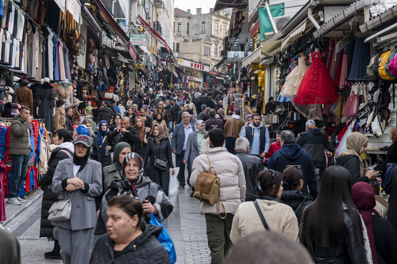 People shop on a street in Istanbul, Türkiye, Feb. 28, 2024. (Reuters Photo)