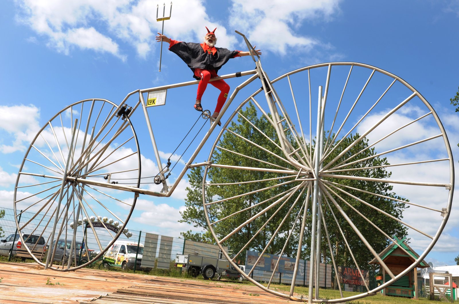 Bicycle designer Dieter (Didi) Senft sits on what its creator claims is the &quot;largest functional bicycle in the world,&quot; Pudagla, Germany, June 1, 2012. (DPA Photo)