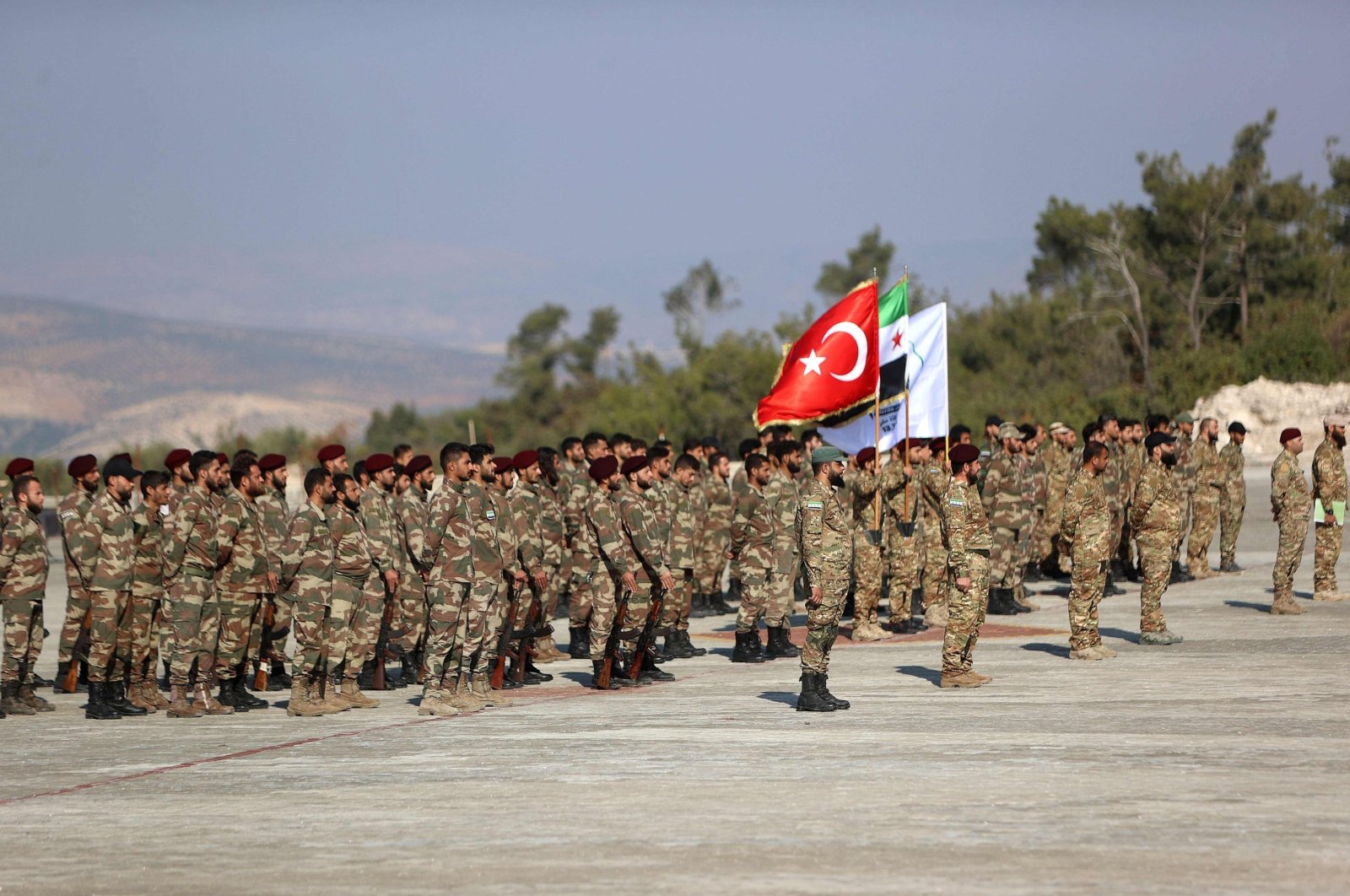 Syrian fighters from the 1st Corps of the Samarkand Brigade take part in a military parade in the opposition-held Afrin, northern Syria, Nov. 23, 2022. (AFP Photo)