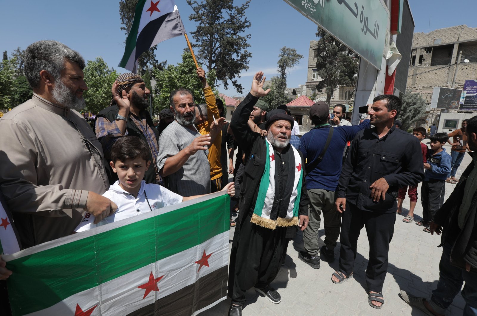 Protesters hold a flag of the Syrian opposition as they condemn the PKK/YPG terrorists&#039; planned "elections" in northern Syria, May 31, 2024. (AA Photo)