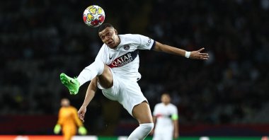 Kylian Mbappe heads the ball during the UEFA Champions League quarterfinal second leg football match against Barcelona at the Estadi Olimpic Lluis Companys, Barcelona, Spain, April 16, 2024. (AFP Photo)