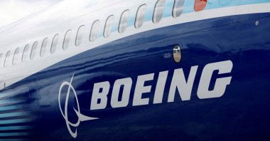The Boeing logo is seen on the side of a Boeing 737 Max at the Farnborough International Airshow, Farnborough, Britain, July 20, 2022. (Reuters Photo)