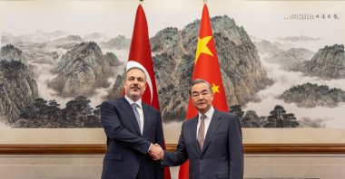 Foreign Minister Hakan Fidan (L) shakes hands with Chinese Foreign Minister Wang Yi, Beijing, China, June 4, 2024. (AA Photo)