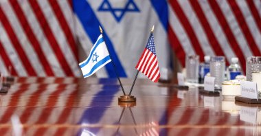 An Israeli and U.S. flag are reflected on a conference table as Defense Secretary Lloyd Austin meets with Israeli Defense Minister Yoav Gallant, at the Pentagon, in Washington, U.S., March 26, 2024. (AP Photo)