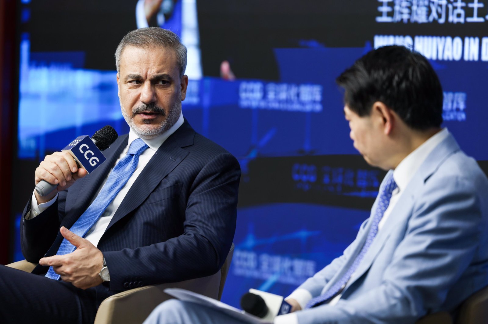 Foreign Minister Hakan Fidan (L) speaks at an event at the Center for China and Globalization, Beijing, China, June 3, 2024. (IHA Photo)