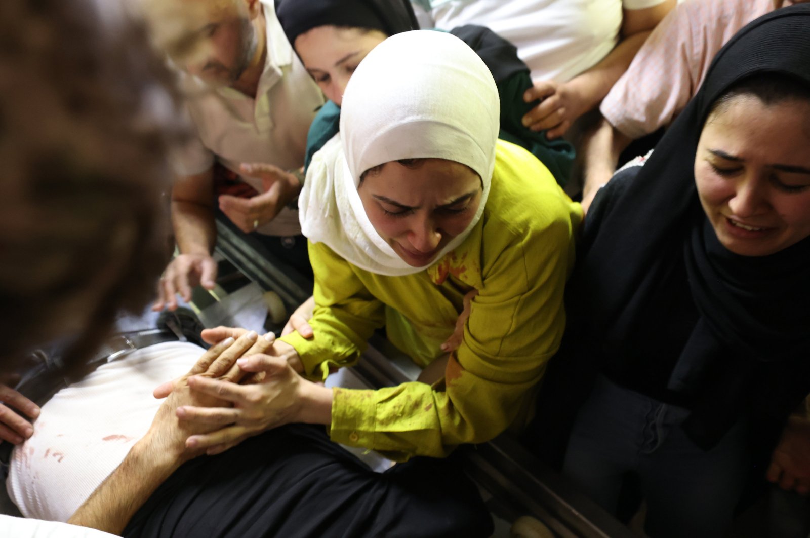 Relatives of Palestinian Motaz Al Nabulsi mourn over his body at Rafedya Hospital in the West Bank city of Nablus, Palestine, June 3, 2024. (EPA Photo)