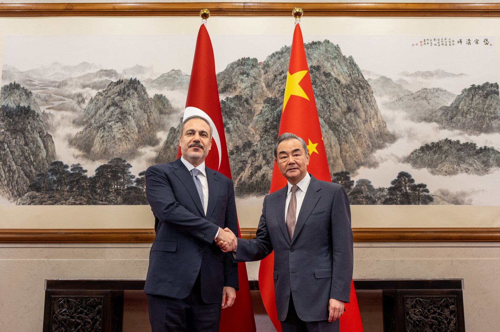 Foreign Minister Hakan Fidan (L) shakes hands with Chinese Foreign Minister Wang Yi, Beijing, China, June 4, 2024. (AA Photo)