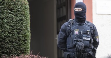 Police officers stand by a searched property in Frankfurt during a raid against so-called &#039;Reich citizens&#039; in Frankfurt, Germany, Dec. 7, 2022. (AP Photo)