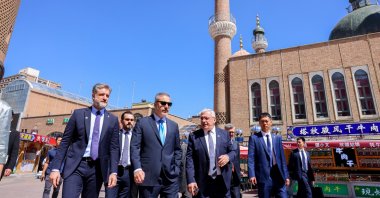 Foreign Minister Hakan Fidan (C) tours the International Grand Bazaar in Urumqi, the capital of Xinjiang province, China, June 5, 2024. (AA Photo)