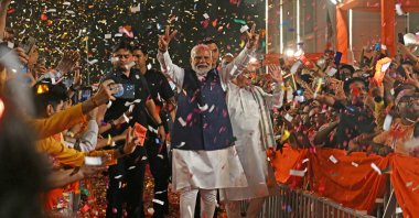India’s Prime Minister Narendra Modi (C) flashes victory sign as he arrives at the Bharatiya Janata Party (BJP) headquarters, in New Delhi, India, June 4, 2024. (AFP Photo)