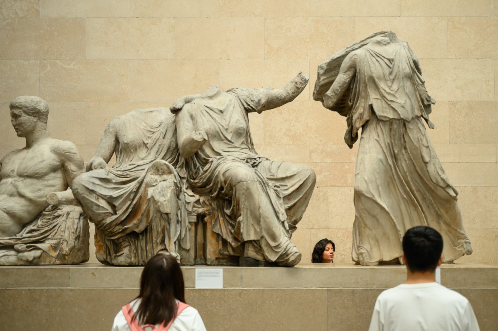 Visitors to the British Museum walk around a selection of items from the collection of ancient Greek sculptures known as the Elgin Marbles, London, U.K., Aug. 23, 2023. (Getty Images Photo)