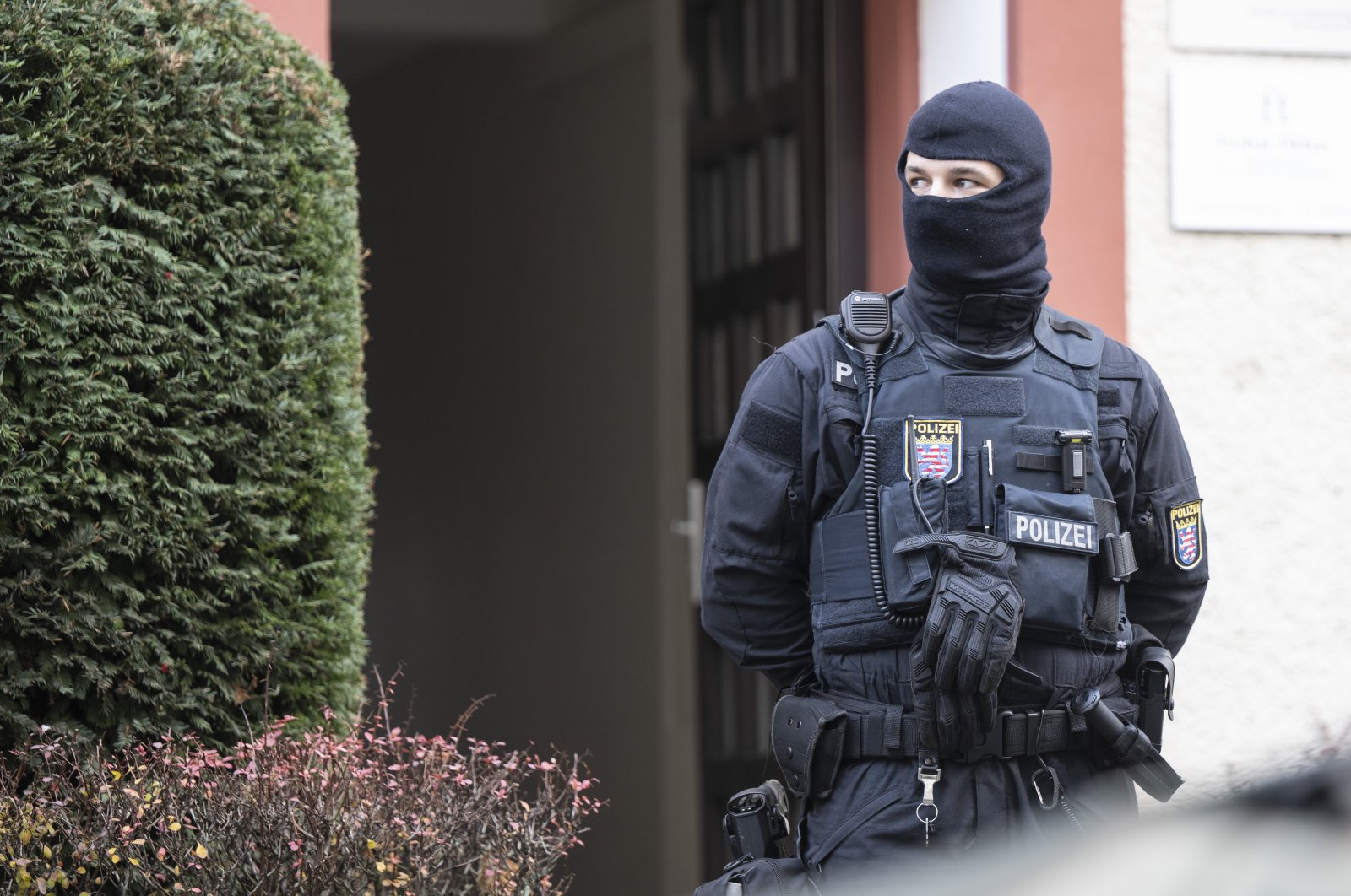 Police officers stand by a searched property in Frankfurt during a raid against so-called &#039;Reich citizens&#039; in Frankfurt, Germany, Dec. 7, 2022. (AP Photo)