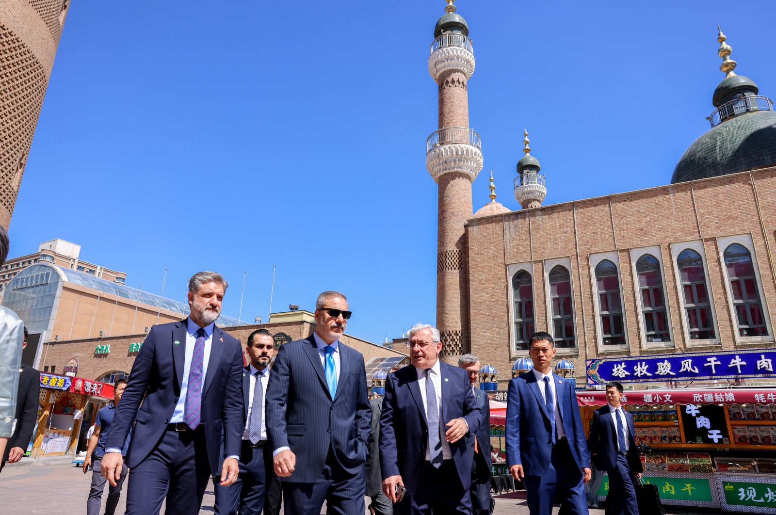 Foreign Minister Hakan Fidan (C) tours the International Grand Bazaar in Urumqi, the capital of Xinjiang province, China, June 5, 2024. (AA Photo)