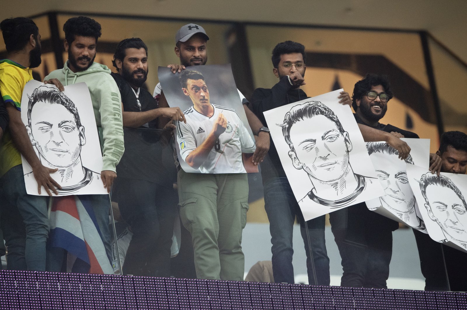 Mesut Ozil fans hold signs during the FIFA World Cup Qatar 2022 Group E match between Costa Rica and Germany at Al-Bayt Stadium, Al Khor, Qatar, Dec. 1, 2022. (Getty Images Photo)