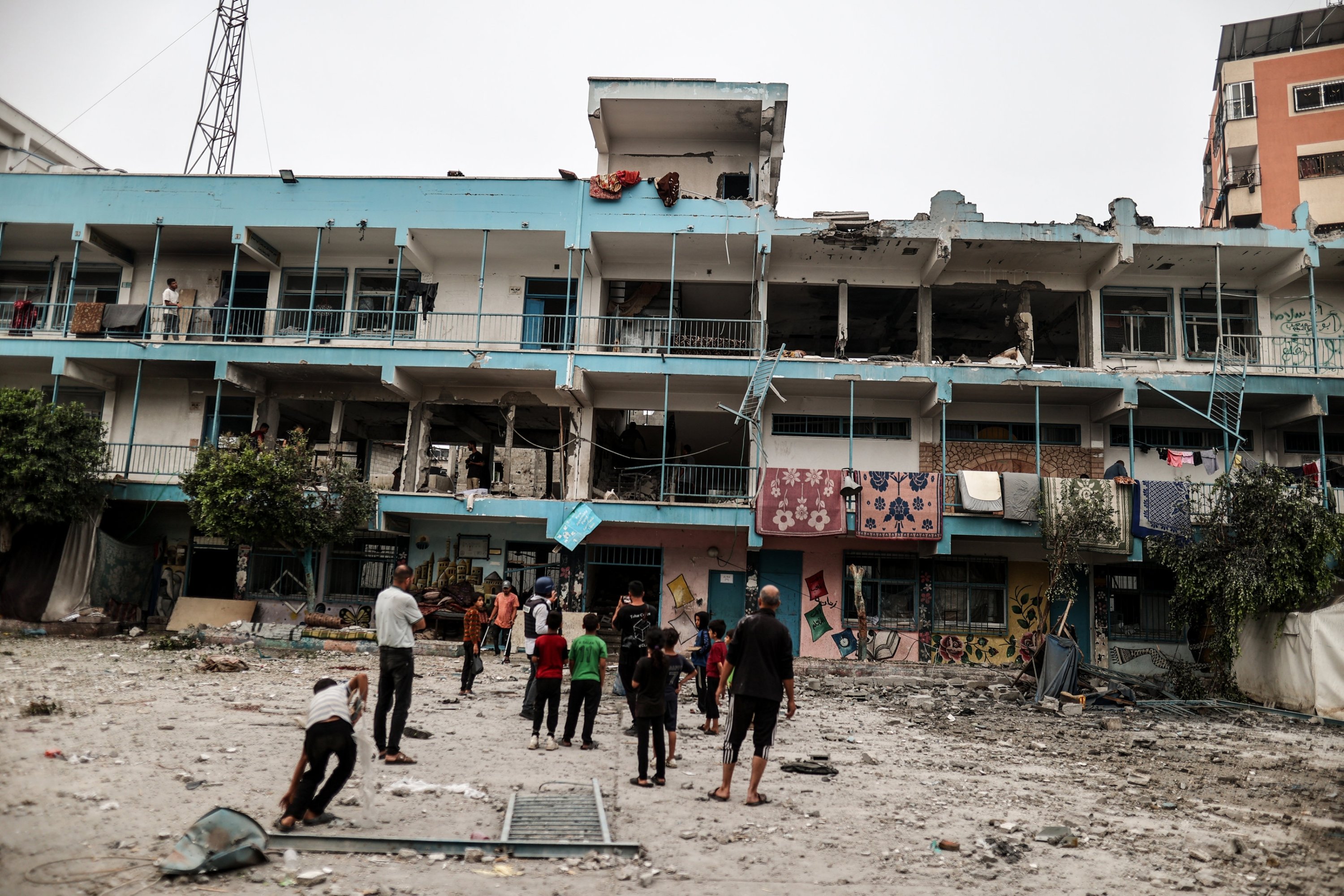 Palestinians examine a UNRWA school building damaged in an Israeli strike on Nuseirat refugee camp, central Gaza, Palestine, June 6, 2024. (AA Photo)
