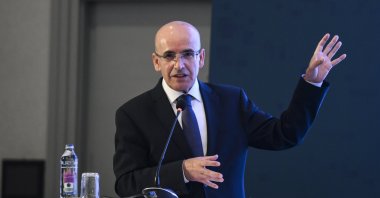 Treasury and Finance Minister Mehmet Şimşek delivers a speech during an event in Istanbul, Türkiye, May 29, 2024. (AA Photo)