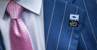 An audience member wears a UFO pin during a House Oversight and Accountability subcommittee hearing on UFOs, on Capitol Hill in Washington, D.C., July 26, 2023. (AP Photo)