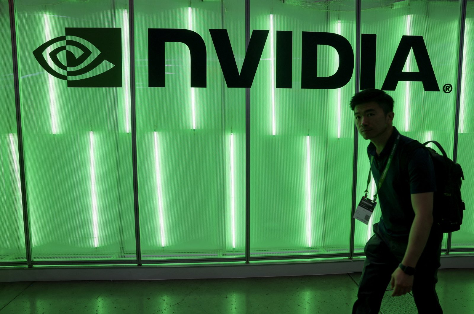 A person walks past a Nvidia logo at Computex in Taipei, Taiwan, June 5, 2024. (Reuters Photo)