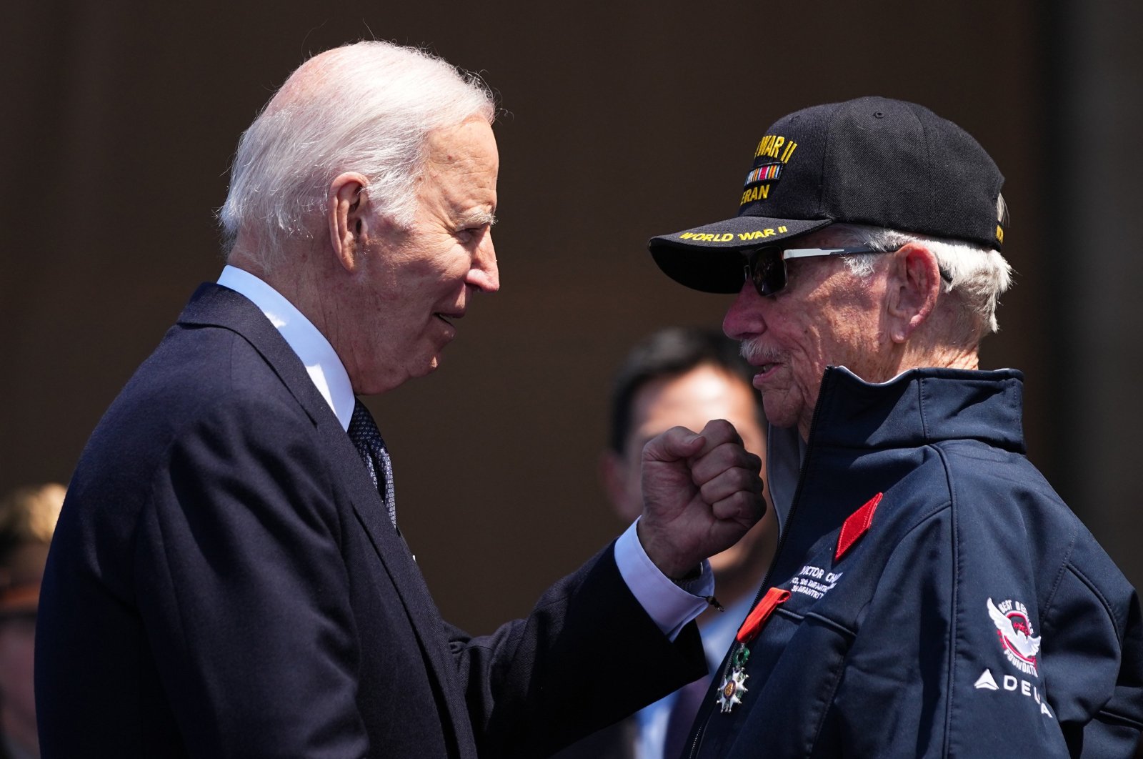 U.S. President Joe Biden greets World War II veteran Victor Charey after he was awarded the Legion of Honor by French President Emmanuel Macron, in Colleville-sur-Mer, Normandy, France, June 6, 2024. (EPA Photo)