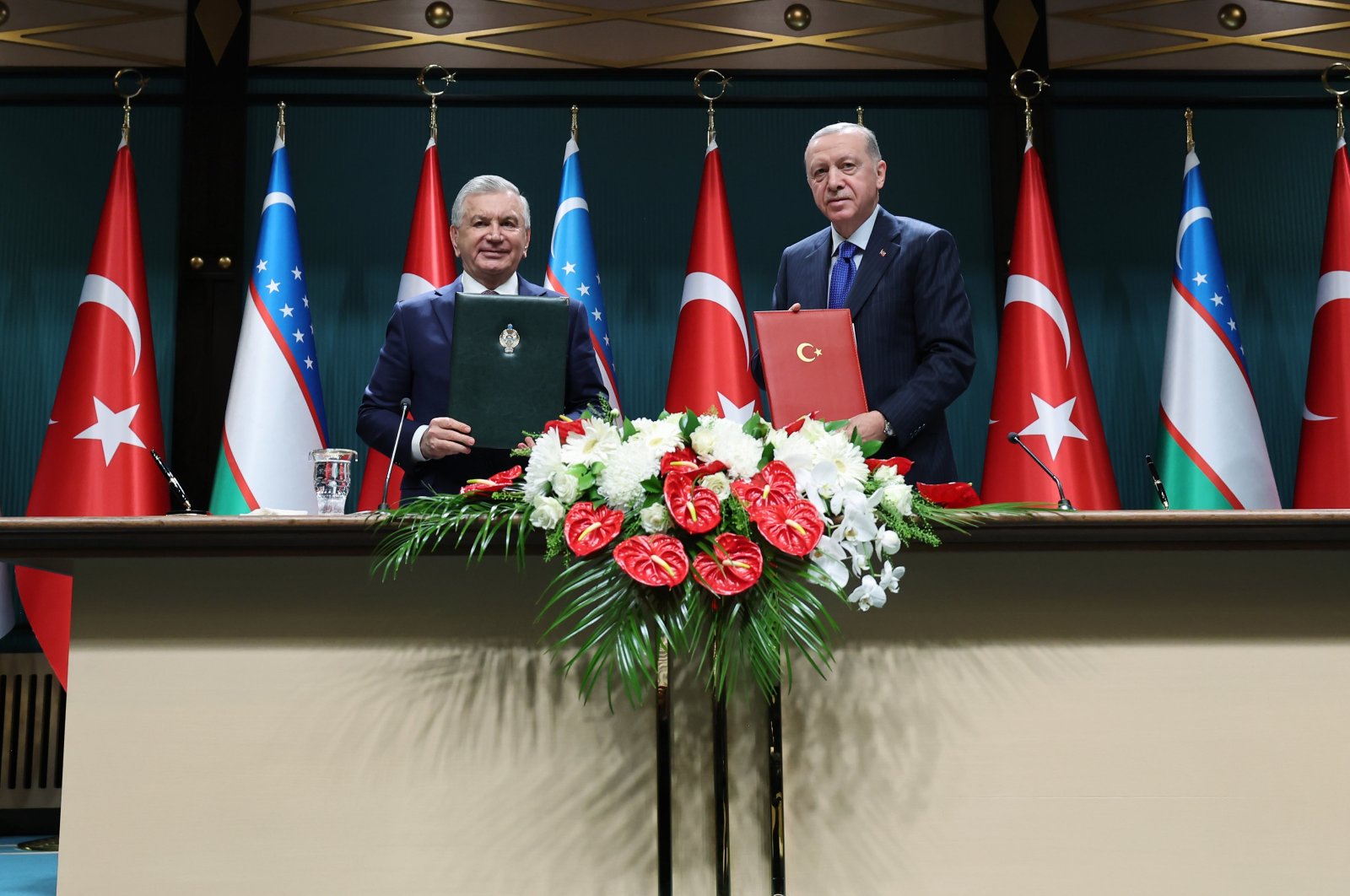 President Recep Tayyip Erdoğan and Uzbek President Shavkat Mirziyoyev pose for a photo after signing bilateral deals in Ankara, June 6, 2024. (AA Photo)
