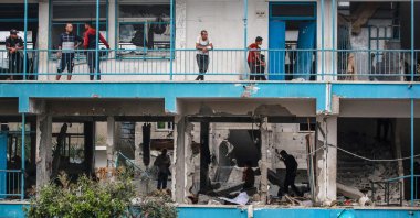 Palestinians check a U.N.-school housing displacing people that was hit during Israeli bombardment in Nuseirat, in the central Gaza Strip, June 6, 2024. (AFP Photo)