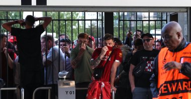 Liverpool fans are held at the gates, many feeling the effects of tear gas ahead of the UEFA Champions League final match between Liverpool and Real Madrid at Stade de France, Paris, France, May 28, 2022. (Getty Images Photo)