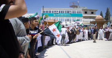 People hold a demonstration protesting the so-called election plans of YPG/PKK terrorists in Tal Abyad, Syria, May 31, 2024. (AA File Photo)