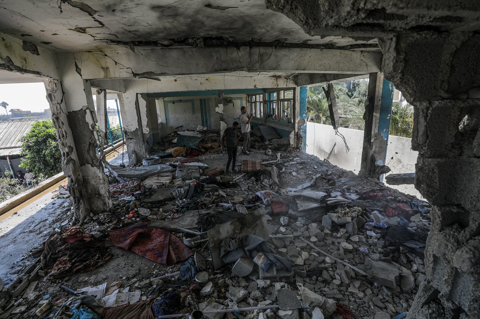 Palestinians inspect a destroyed UNRWA school following an Israeli air strike in Al Nusairat refugee camp, Gaza Strip, Palestine, June 6, 2024. (EPA Photo)