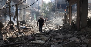 A Palestinian man wan walks on the rubble of destroyed buildings following an operation by the Israeli Special Forces in the Nuseirat camp, in the central Gaza Strip, Palestine, June 8, 2024. (EPA Photo)