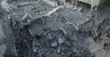 Palestinians inspect a house hit in an Israeli strike in Nuseirat refugee camp in the central Gaza Strip, Palestine, June 8, 2024. (Reuters Photo)