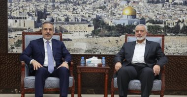 Foreign Minister Hakan Fidan (L) poses with Ismail Haniyeh of Hamas, in Doha, Qatar, June 9, 2024. (AA Photo) 