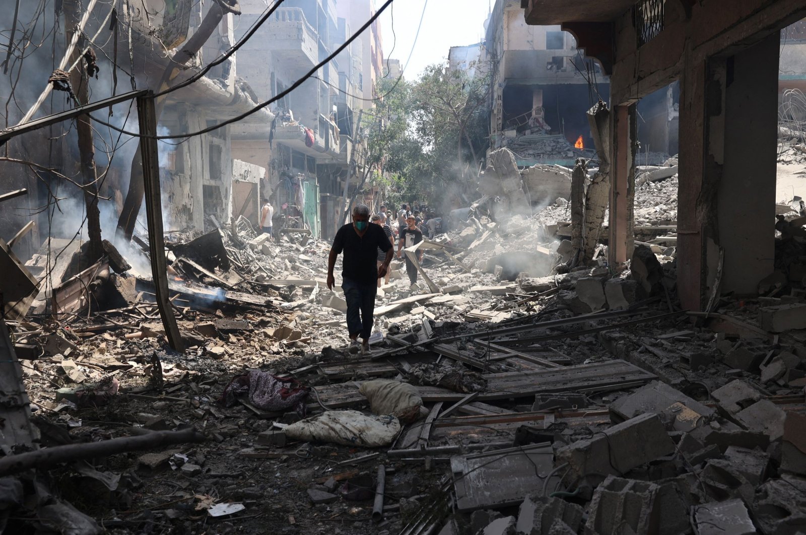 A Palestinian man wan walks on the rubble of destroyed buildings following an operation by the Israeli Special Forces in the Nuseirat camp, in the central Gaza Strip, Palestine, June 8, 2024. (EPA Photo)