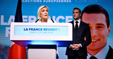 French far-right Rassemblement National (RN) party leader Marine Le Pen (L) addresses members as party President Jordan Bardella listens, in Paris, France, June 9, 2024. (AFP Photo)