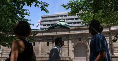 Pedestrians walk in front of the Bank of Japan headquarters in Tokyo, Japan, May 30, 2024. (AFP Photo)