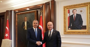 Interior Minister Ali Yerlikaya (L) shakes hands with CHP Deputy Chair Murat Bakan, Ankara, Türkiye, June 10, 2024. (İHA Photo)