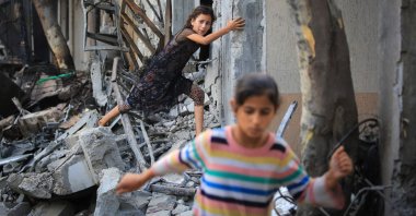 A Palestinian girl climbs over debris a day after an operation by the Israeli Special Forces in the Nuseirat camp, in the central Gaza Strip, Palestine, June 9, 2024. (AFP Photo)