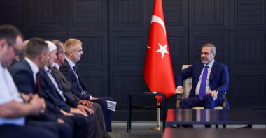Foreign Minister Hakan Fidan receives the representatives of the Ahıska Turk community during a visit to Moscow, Russia, June 10, 2024. (AA Photo)