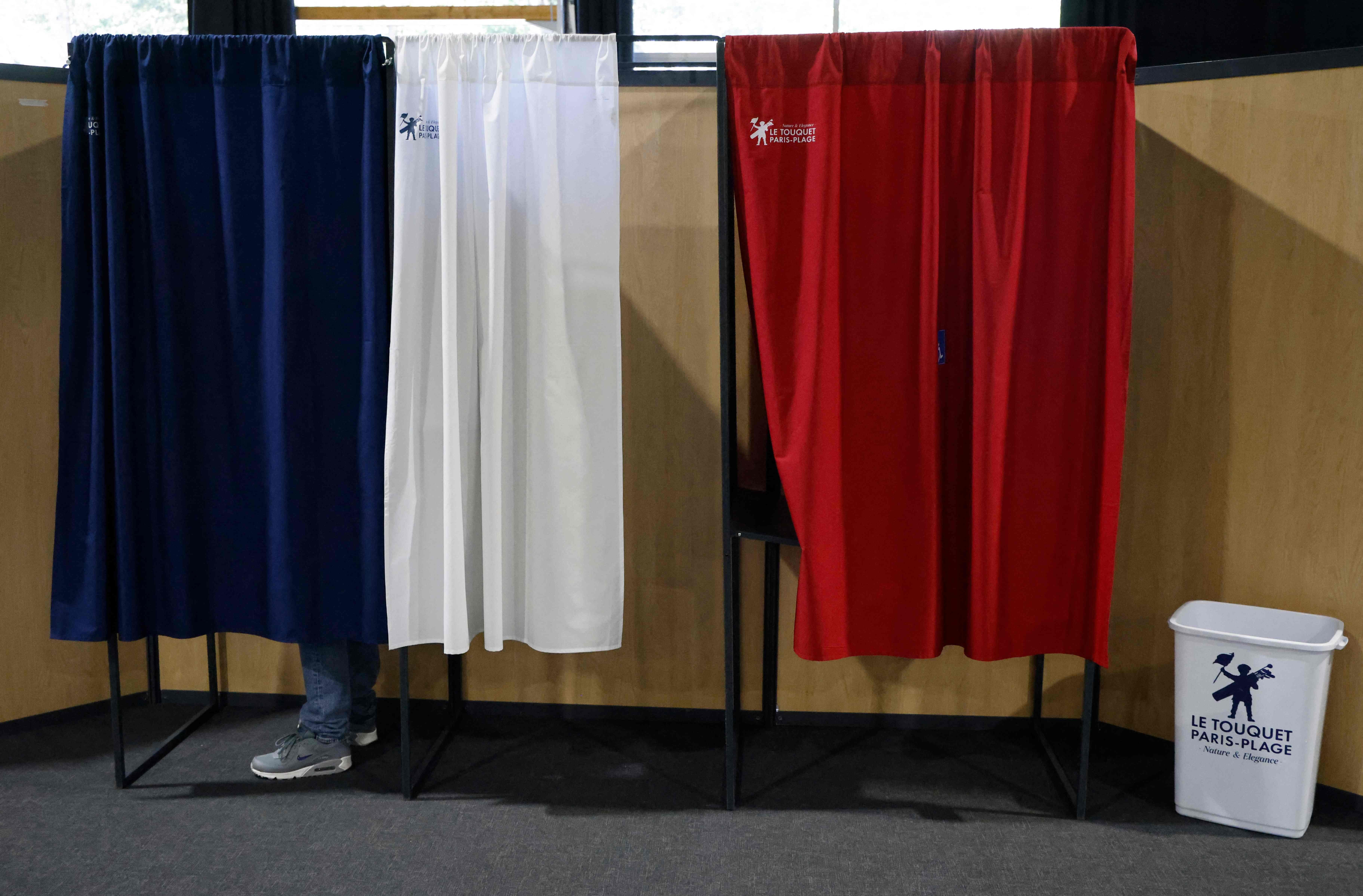 A voter stands in a polling booth during the European Parliament election at a polling station in Le Touquet, northern France, June 9, 2024. (AFP Photo)