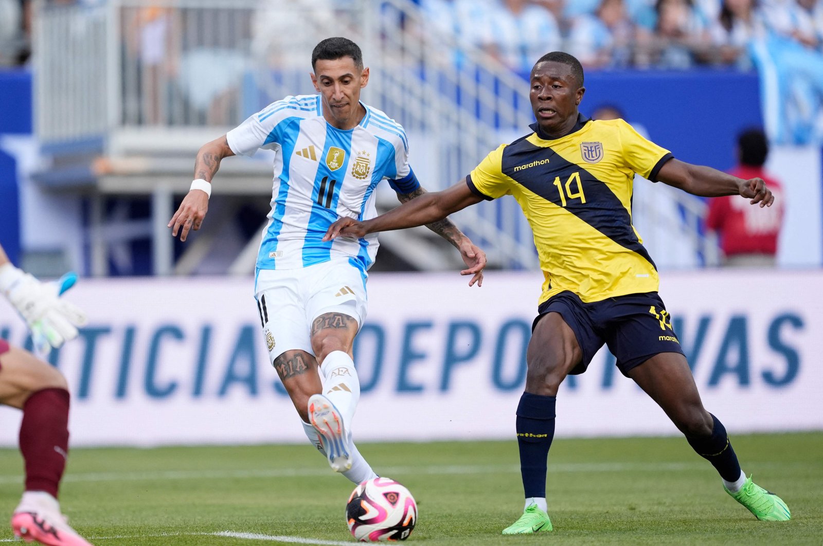 Argentina&#039;s Angel Di Maria (L) scores a goal past Ecuador&#039;s Alan Minda in the first half during an International Friendly match at Soldier Field, Chicago, Illinois, U.S., June 9, 2024. (AFP Photo)