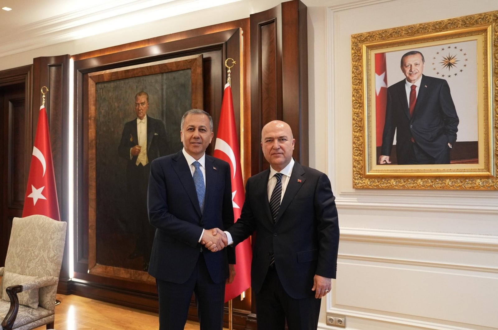 Interior Minister Ali Yerlikaya (L) shakes hands with CHP Deputy Chair Murat Bakan, Ankara, Türkiye, June 10, 2024. (İHA Photo)