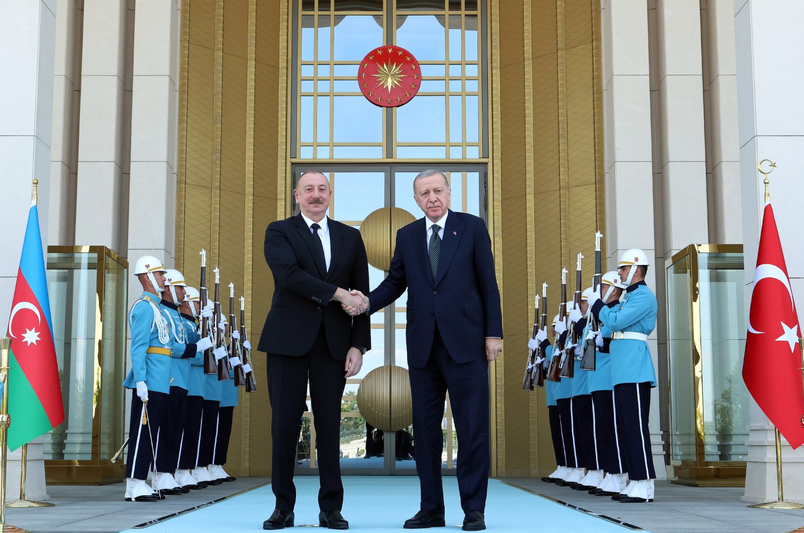 President Recep Tayyip Erdoğan (R) shakes hands with Azerbaijani President Ilham Aliyev outside the Presidential Complex, Ankara, Türkiye, June 10, 2024. (AA Photo)