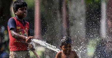 Children play with water during a hot summer day amid a severe heat wave, New Delhi, India, May 31, 2024. (AFP Photo)
