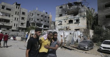 Palestinians help a wounded man after Israeli strikes in Nuseirat refugee camp, Gaza Strip, Palestine, June 8, 2024. (AP Photo)