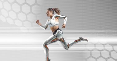 A female cyborg runs near a tech background. (Getty Images Photo)