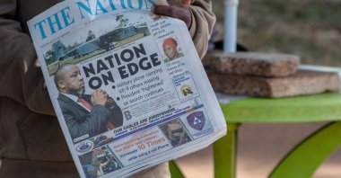 A newspaper vendor holds The Nation newspaper with a cover picture of the missing plane Vice State President Saulos Klaus Chilima in Lilongwe, Malawi, June 11, 2024. (AFP Photo)