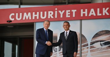 President Recep Tayyip Erdoğan (L) shakes hands with Özgür Özel outside the CHP offices, Ankara, Türkiye, June 11, 2024. (AA Photo)